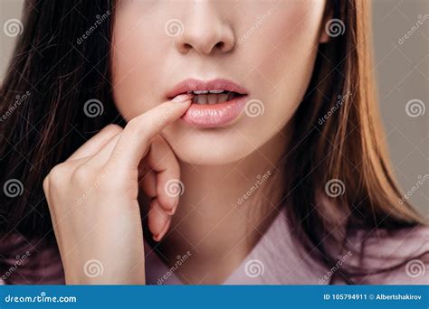 Beautiful Brunette Woman With A Finger At Her Mouth On White Background Stock Image Image Of