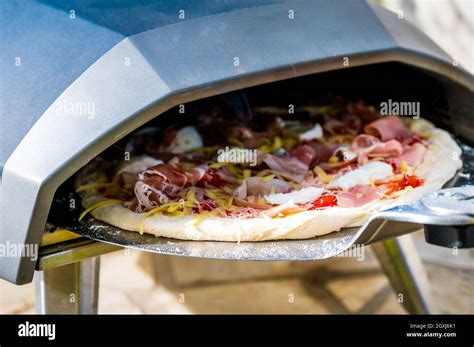 Making Homemade Pizza In Portable High Temperature Gas Pizza Oven