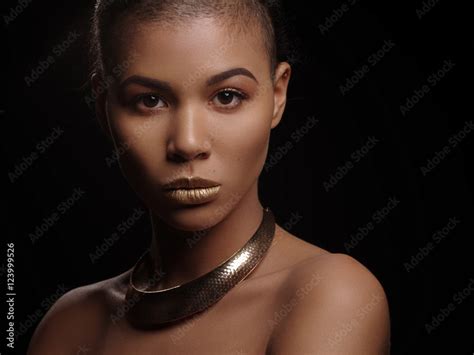 Fashion Portrait Of A Beautiful Naked African American Woman With Perfect Smooth Glowing Mulatto