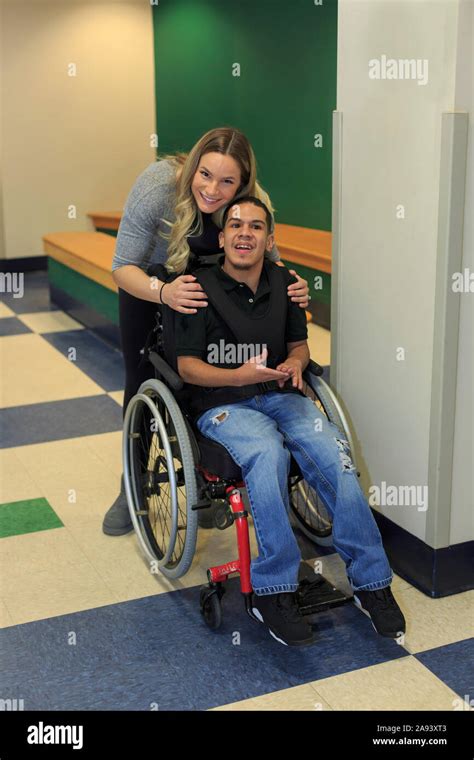 Boy With Spastic Quadriplegic Cerebral Palsy And Teacher In The School