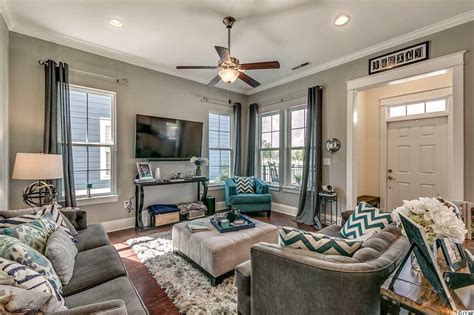 Like the color/design of the area rug with the chairs. Gray and turquoise living room | Turquoise grey living room, Living room turquoise, Turquoise ...