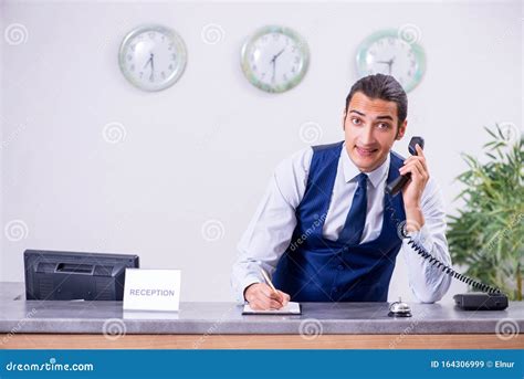 Young Man Receptionist At The Hotel Counter Stock Image Image Of
