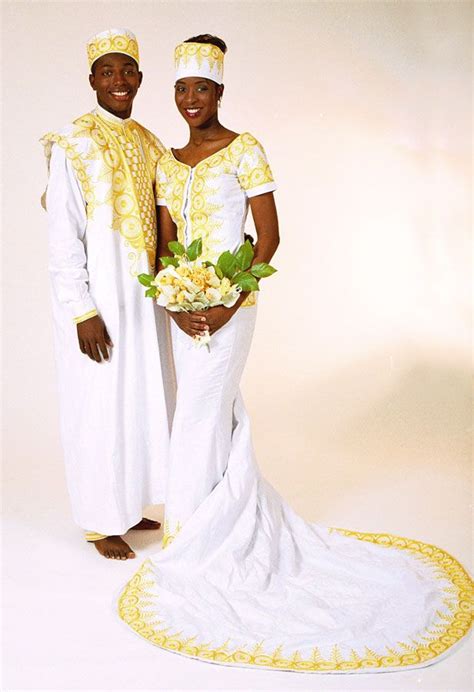 Gold Embroidered African Bridal Gown And Grooms Agbada Dashiki Shirt Trousers And Hat By