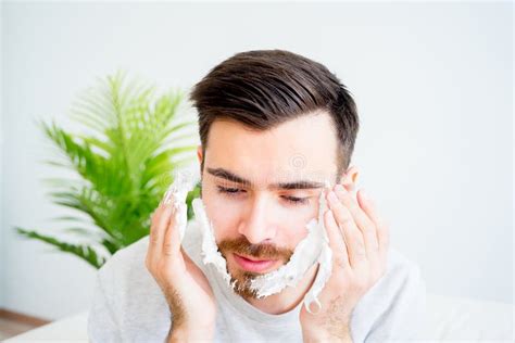 man shaving his beard stock image image of razor adult 92091773