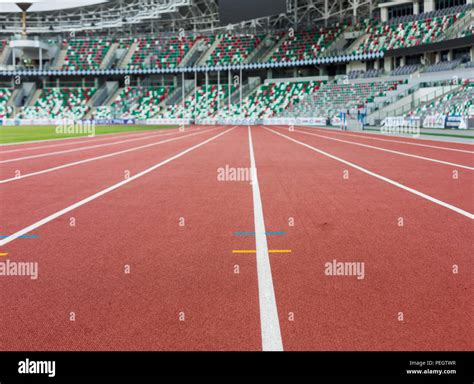 Red Sport Track For Running On Stadium With Tribune Running Healthy