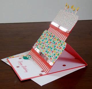 A Birthday Card With Candles Sticking Out Of It