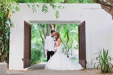 Couple Pictures By The Saguaro Entrance In The Park Wedding Ceremony