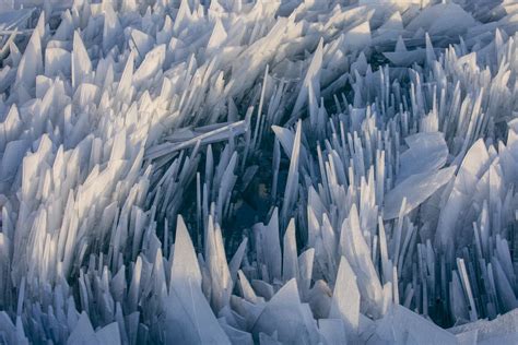 Piles Of Jagged Ice Shards Create Surreal Scene On Lake Michigan