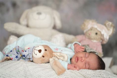 Small Baby Laying On Bed With Toys Stock Image Image Of Beautiful