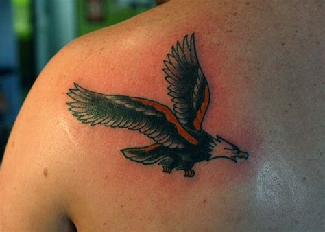 Colorful Traditional Flying Eagle Tattoo On Back Shoulder