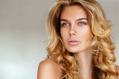 Beautiful Tender Blonde Girl With Long Hair And Puffy Lips Without