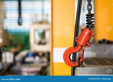 Red Crane Hook Of Overhead Crane In Manufacturing Factory Stock Photo