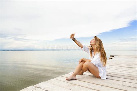 Young Blonde Woman Taking A Selfie On The Beach Stock Image Image Of Beautiful Lovely 39151263