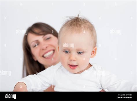 Happy Mother Holding Her Cute Baby Stock Photo Alamy