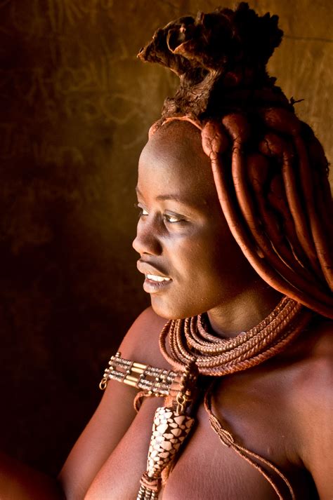 An African Woman With Braids On Her Head