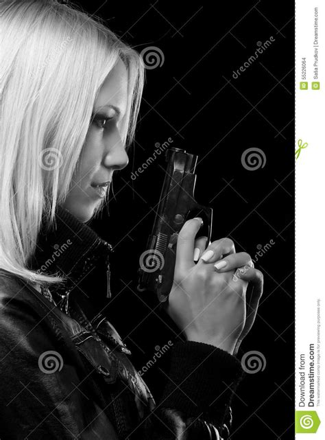 Beautiful Girl With Gun Isolated On Black Background Stock Photo