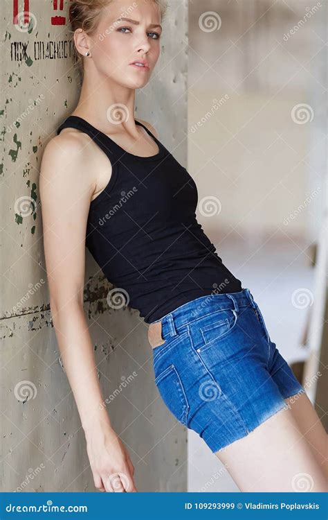 Blond Girl In Denim Shorts And Black Shirt Stock Image Image Of Hair
