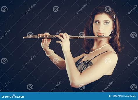 Woman Playing Transverse Flute On Black Stock Image Image Of