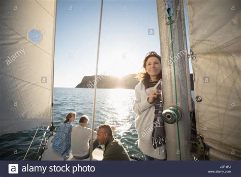 Portrait Smiling Mature Woman On Sunny Sailboat Stock Photo Alamy