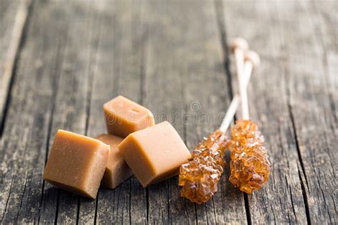 Brown Sugar Crystals On Stick And Caramel Candies Stock Photo Image