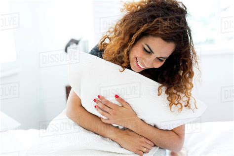 Woman Holding Pillow Stock Photo Dissolve