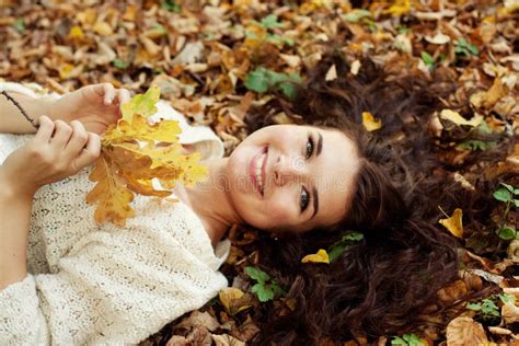 Woman Lying On Autumn Leaves Outdoor Portrait Stock Image Image Of