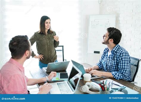 Executives Working On Business Ideas In Office Meeting Stock Photo