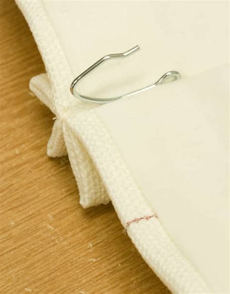 Draw the curtains and let them sit for 1 hour to make sure the adhesive hooks can hold the weight. How to Hang Pinch Pleat Curtains