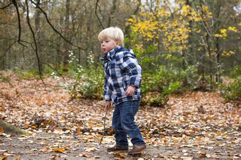 Little Boy Playing In The Woods — Stock Photo © Mactrunk