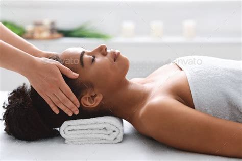 Young Black Woman Getting Head Massage From Massage Therapist Head