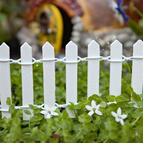 Alternating white picket fence and white beautiful flowers #fence #buildfence #gardenfence #gardenfenceideas #privacyfenceideas #privacyfence #backyardlandscaping #backyardlandscapingideas #landscaping #privacylandscape #landscape. Fairy Gardening|White Picket Fence|Fairy Garden Fence