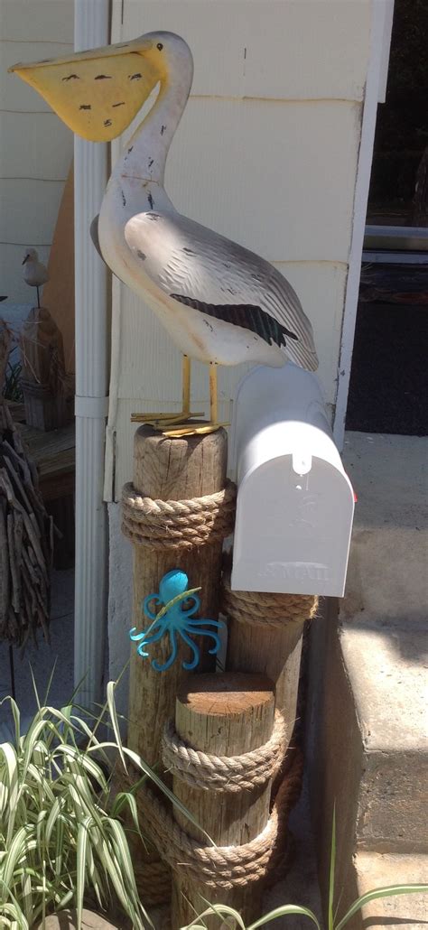 A cottage style home evokes nostalgia. Pelican mailbox at our "beach house". | Beach cottage ...