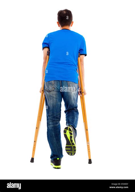 Full Length Portrait Of Young Asian Man On Crutches Stock Photo Alamy