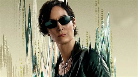 See Carrie Anne Moss Rock A Deep Cut Dress Covered In Code For The