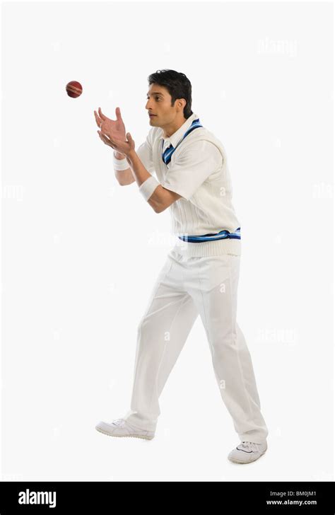 Cricket Player Catching A Ball Stock Photo Alamy
