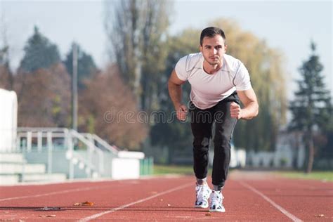 Athlete Man Sprinting On The Running Track Stock Photo Image Of Line