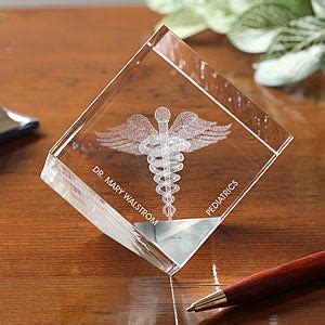 Best gift ideas for doctors 1. 3-D Crystal Caduceus Personalized Medical Doctor Paperweight