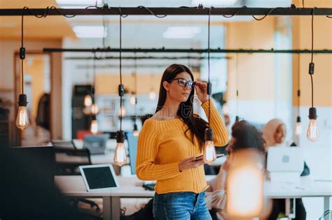 Female Boss Manager Executive Posing In A Modern Startup Office While