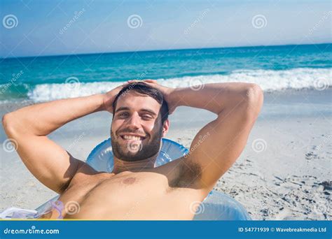 Handsome Man Lying On The Beach Looking At Camera Stock Image Image