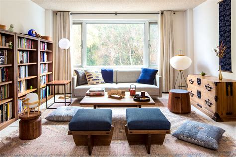 A Living Room Filled With Lots Of Furniture And Bookshelves Next To A