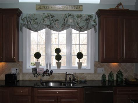 This fun, functional roman shade is enhanced by bead trim. Kitchen Window Treatments - Traditional - Window ...