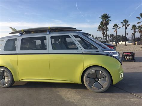 3 New Volkswagen Evs Car Suv And Hippie Van On Long Beach Beach