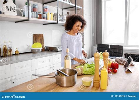 Young African American Woman Cooking In Kitchen Stock Photo Image Of