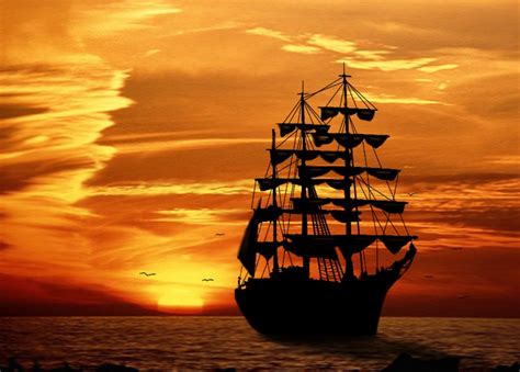 Sunset At Sea A Silhouette Of A Sailing Ship At