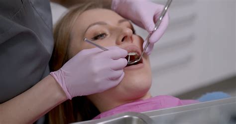 A Dentist Giving Dental Service To A Patient · Free Stock Video