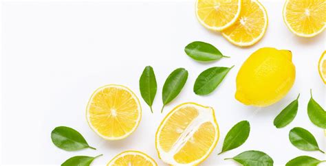 Premium Photo Fresh Lemon And Slices With Leaves Isolated On White