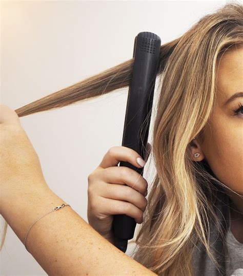 How To Curl Your Hair With A Flat Iron According To Stylists Curl
