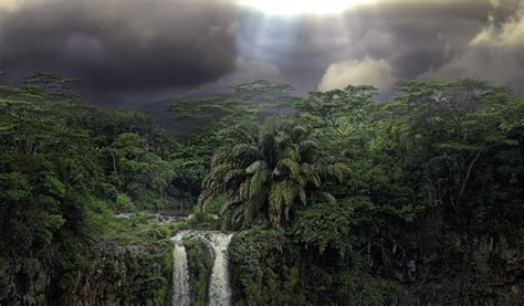 Dark Clouds Over Rainforest Waterfall