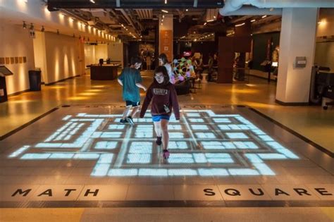Visitors Interact With The Math Square Display At The National Museum