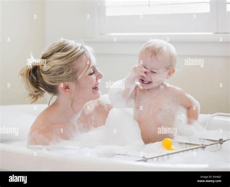 Mother And Baby Taking A Bubble Bath Stock Photo Alamy